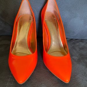 Bright orange pumps